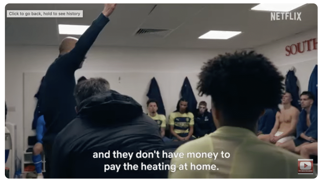 Pep Guardiola delivering a passionate half-time talk to Manchester City players, emphasizing playing for fans who sacrifice to support the team