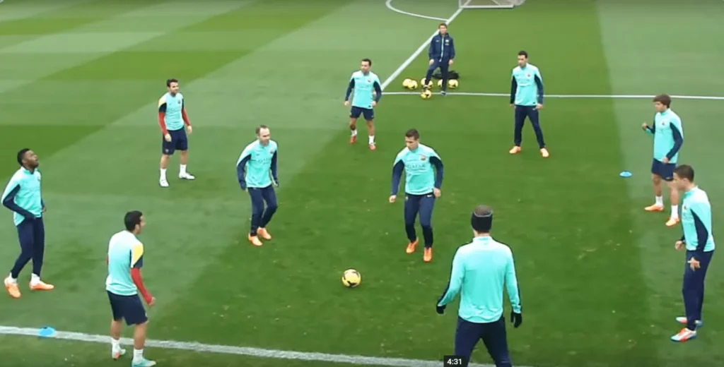 Young players performing rondo training drill in circle formation for Toronto football training development and skill building