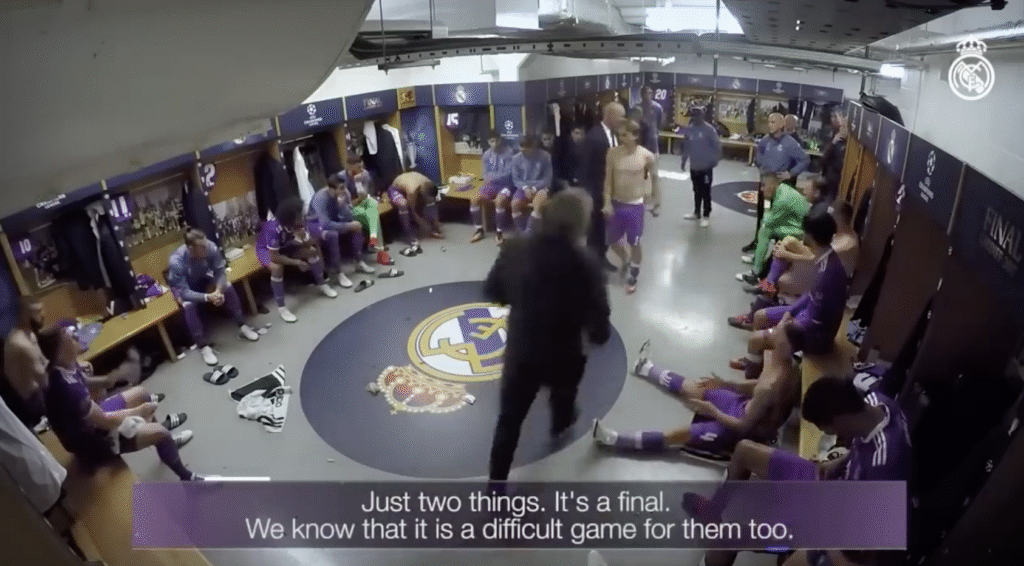 Zinedine Zidane delivering his famous half-time talk to Real Madrid players during the 2017 Champions League final, showing his calm leadership approach in the dressing room