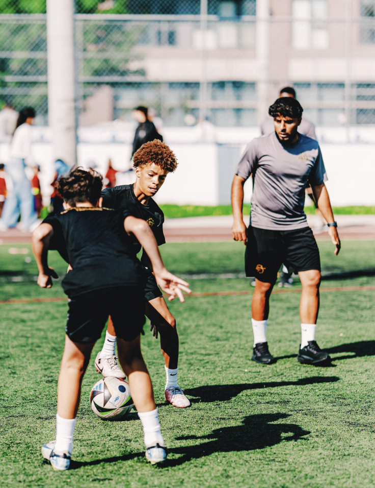 AFT founder Abz Elchanti coaching youth soccer players on field training techniques